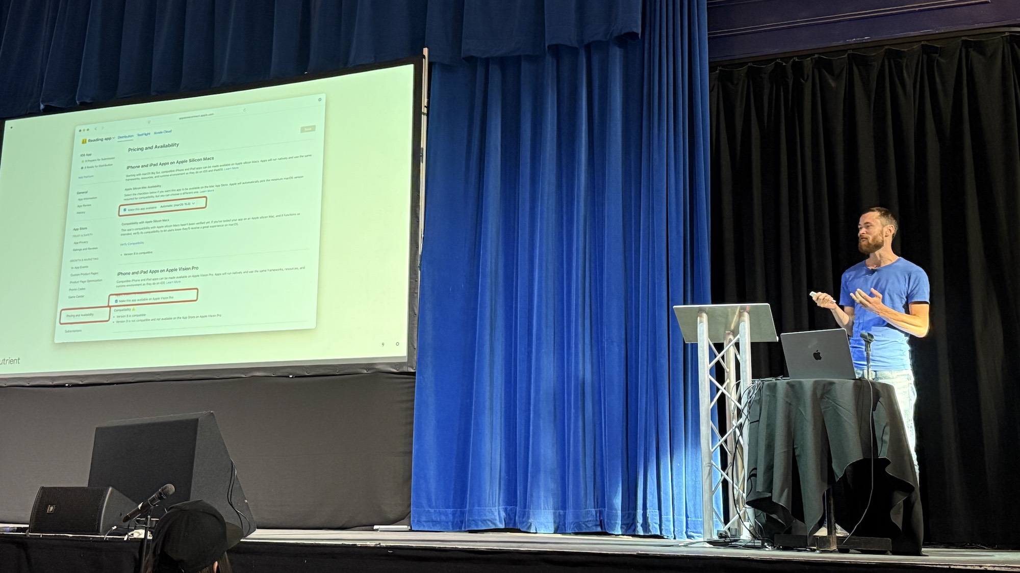 Photo from the talk. Slide shows App Store Connect website with options for enabling distribution on Mac and Vision.