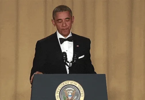 animation of Barack Obama standing at a podium, kissing his fingers, and dropping a microphone