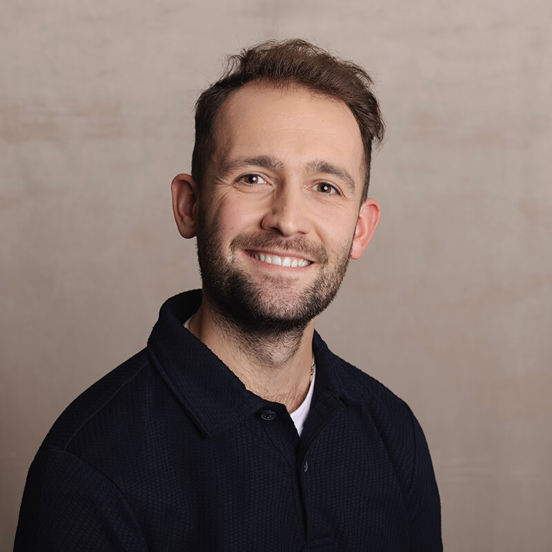 Portrait photo of Ollie Cook, Customer Success Representative