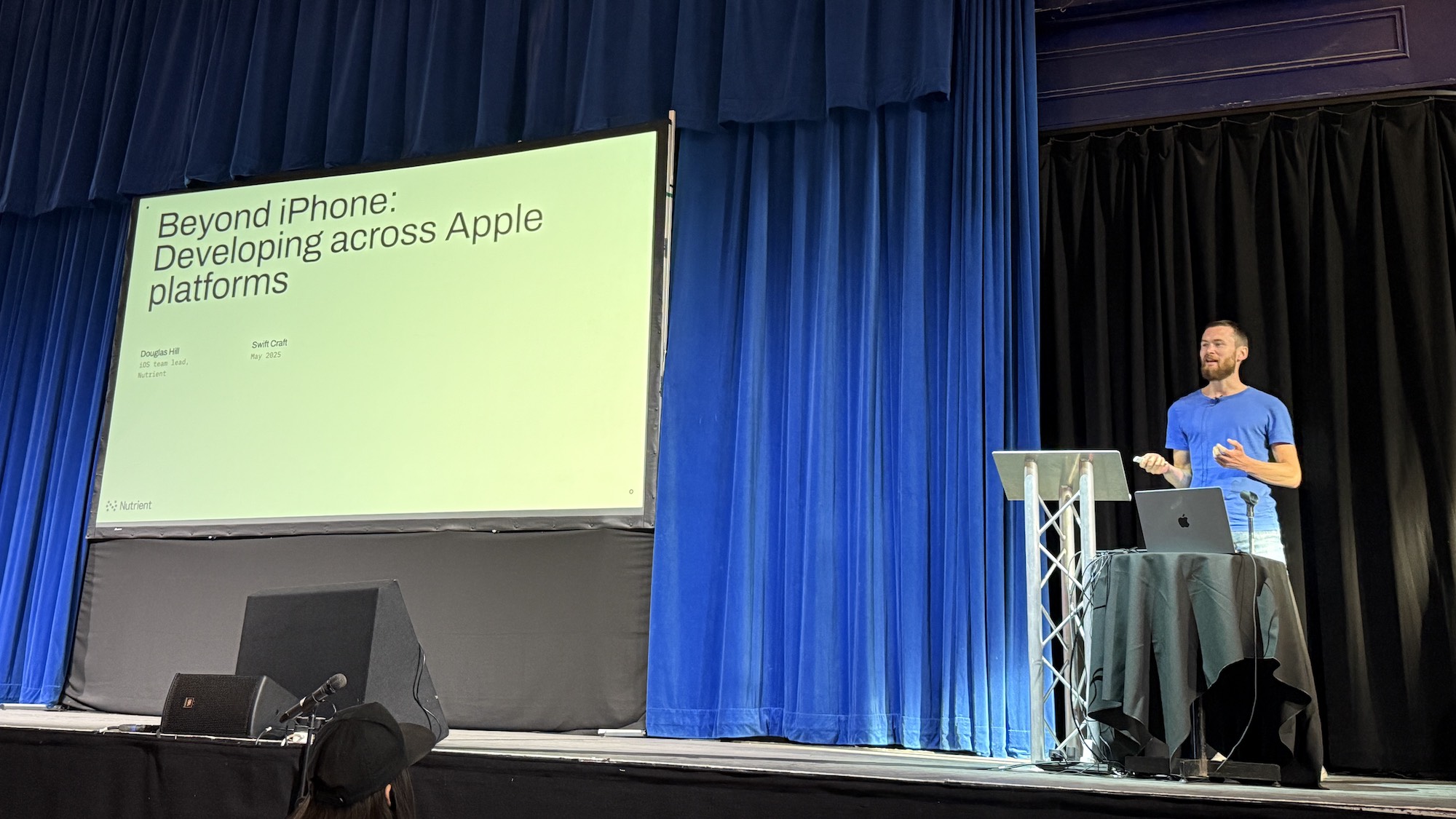 Photo from the start of the talk, showing the cover slide, which says “Beyond iPhone: Developing across Apple platforms, Douglas Hill, iOS team lead, Nutrient, Swift Craft, May 2025”